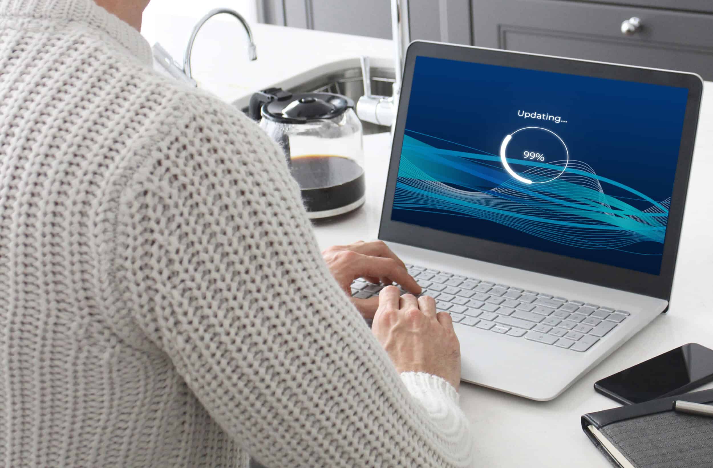 A laptop loading a fictional software update.